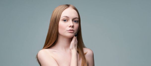 Young pretty woman studio portrait. Cosmetology concept - Фото, изображение