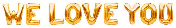 Golden words WE LOVE YOU made of inflatable balloons isolated on white background. Gold foil helium balloon letters, love message, balloons lettering - Photo, Image
