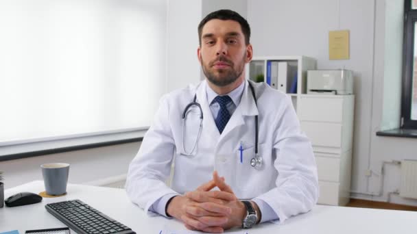 male doctor having video conference at hospital - Filmati, video