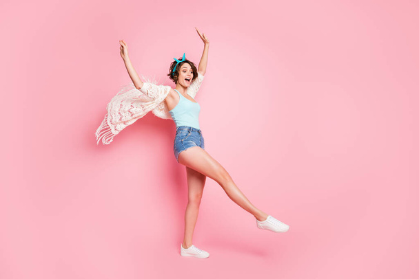 Full length body size view of her she nice attractive lovely pretty charming thin slender cheerful cheery girl rising hands up having fun air wind blowing isolated over pink pastel color background - Φωτογραφία, εικόνα