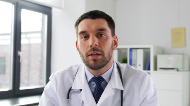 male doctor having video conference at hospital - Materiał filmowy, wideo