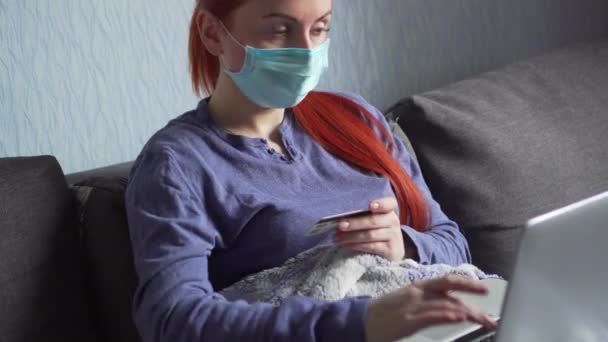 A woman makes online purchases in quarantine at home. - Video