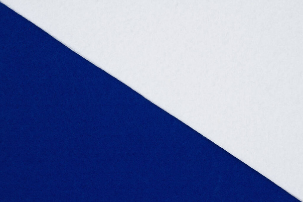 Blue and white felt material background that is divided on the diagonal - Foto, immagini