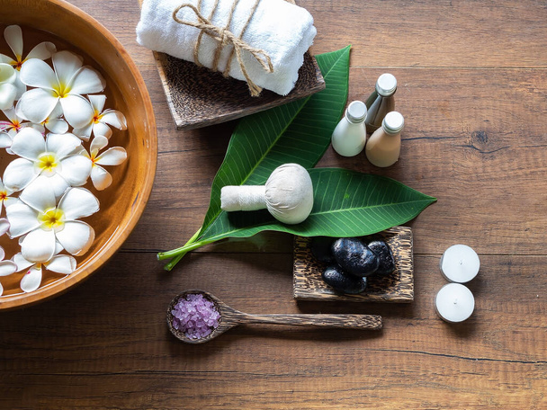 Spa feet and hand thai massage compress balls, herbal ball on the wooden with treatments spa , summer day,Thailand. Healthy Concept - Photo, Image