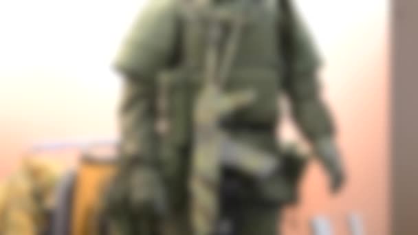 Blurred background. Mannequin dressed various body armor - Footage, Video