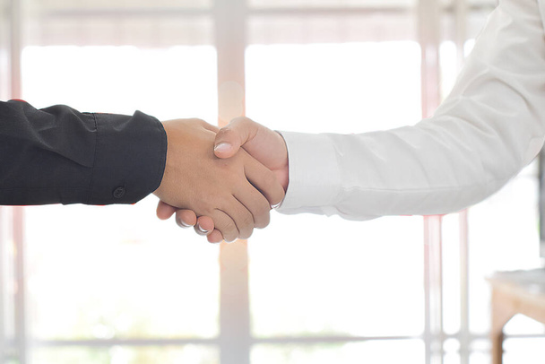 Two business men shaking hands - Fotografie, Obrázek