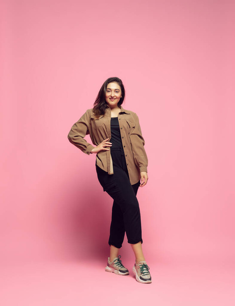 Young caucasian woman in casual wear. Bodypositive female character. plus size businesswoman - Photo, image