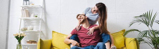 happy beautiful young couple hugging at home, panoramic orientation - Фото, зображення
