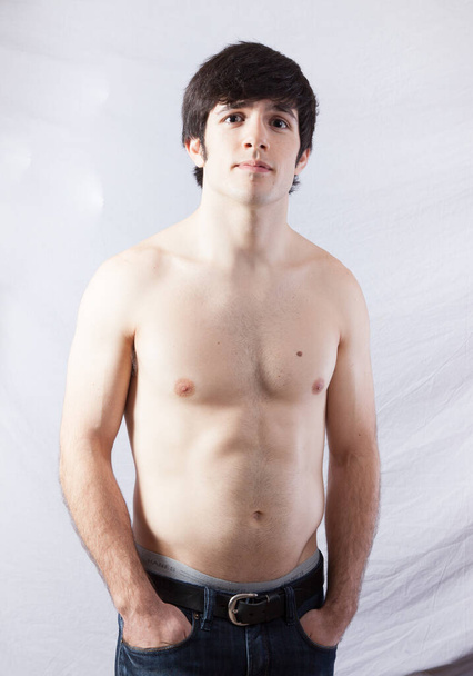 Задумчивый человек без рубашки  - Фото, изображение