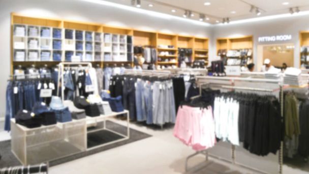clothing store, abstract blurred showcases fashion boutique shop background in modern shopping mall, jeans zone - Photo, Image