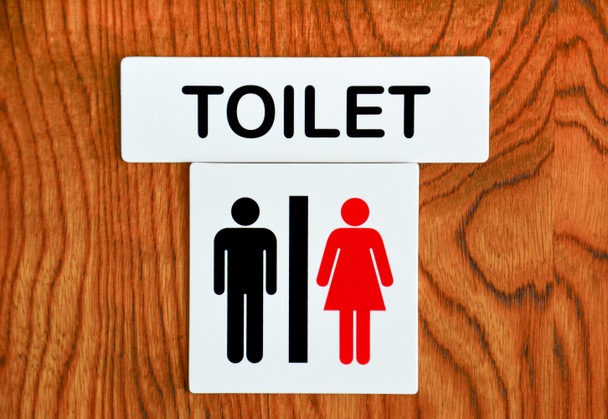 unisex τουαλέτα τραγουδούν σε ξύλινο τοίχο υφή φόντου - Φωτογραφία, εικόνα