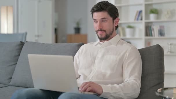 Ambitious Businessman Celebrating Success on Laptop at Home  - Filmagem, Vídeo