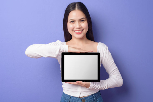 Young woman is holding tablet Mockup - Fotoğraf, Görsel
