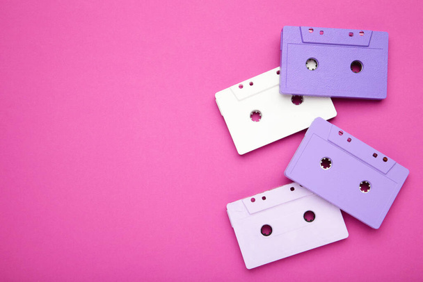 Old colorful cassettes on a pink background. Music day, top view - Foto, immagini