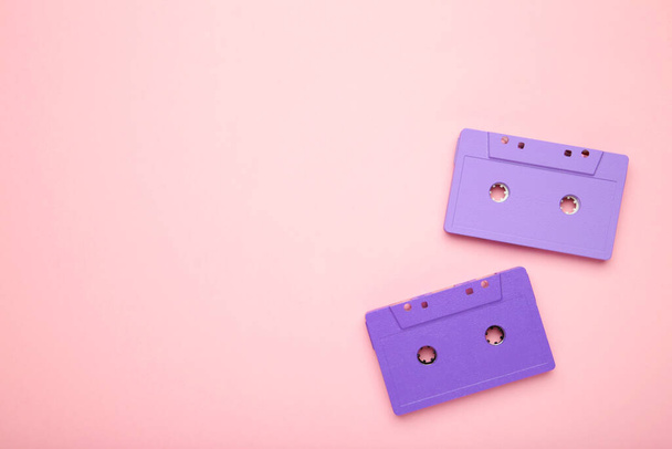 Two old colorful cassettes on a pink background. Music day, top view - Fotó, kép