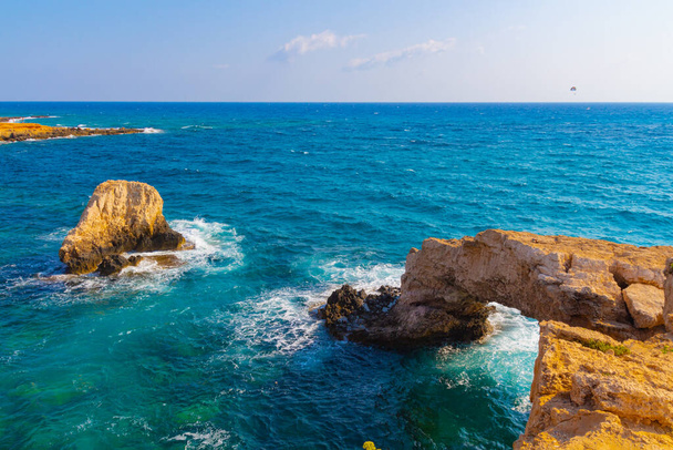 The bridge of lovers or Monk seal arch, stone cliffs in the Mediterranean sea in Ayia Napa, Cyprus. - Photo, Image