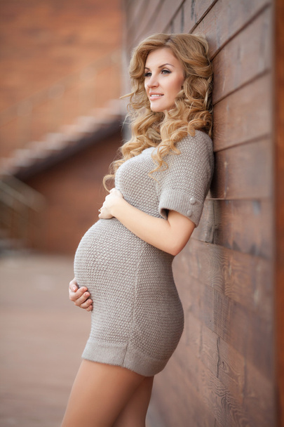 Happy pregnant woman outdoors in park - Valokuva, kuva
