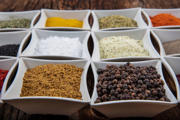 Various spices on wooden background. Top view with copy space. - Foto, Imagem