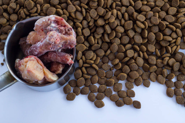 Dry,adult dog food with uncooked chicken,top view - Photo, Image