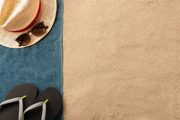 Straw has, sunglasses and flip flops on the sand. Summer vacation concept - Φωτογραφία, εικόνα