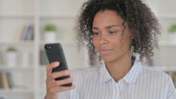 Attractive African Woman using Smartphone  - Video