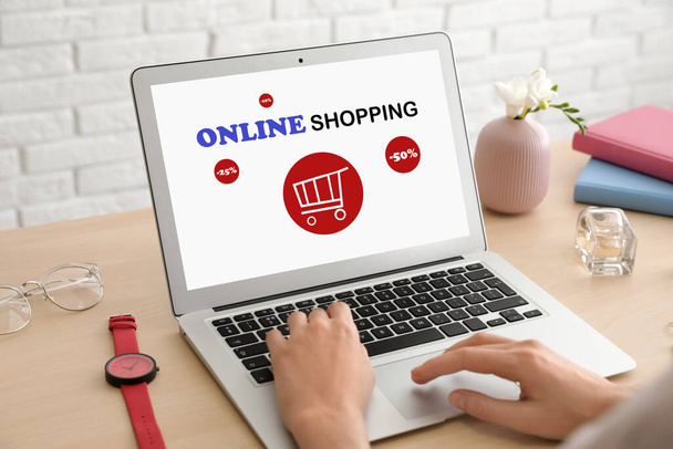 Woman using laptop for online shopping indoors, closeup - Fotografie, Obrázek