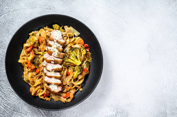 Grilled duck breast with Udon noodles and vegetables. Gray background. Top view. Copy space. - Φωτογραφία, εικόνα