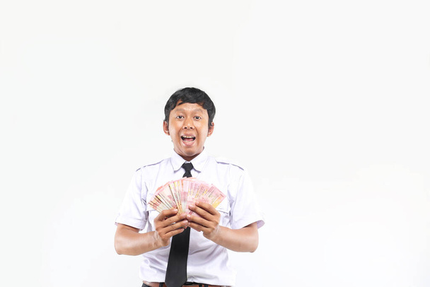 junge asiatische Geschäftsmann hält Geld rupia - Foto, Bild