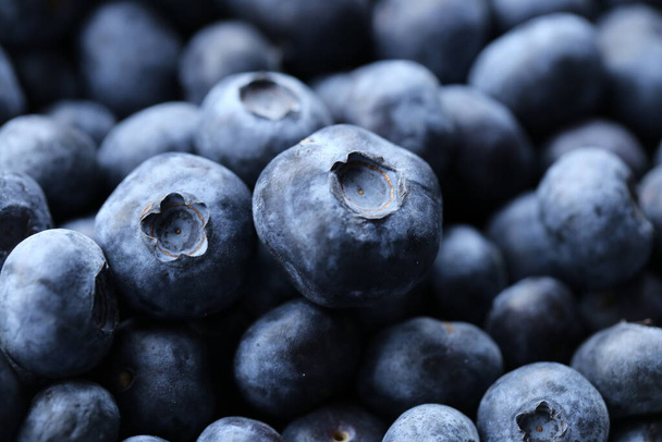 Blueberry berry. Berry blue background.Macro shot of fresh blueberry - Photo, Image