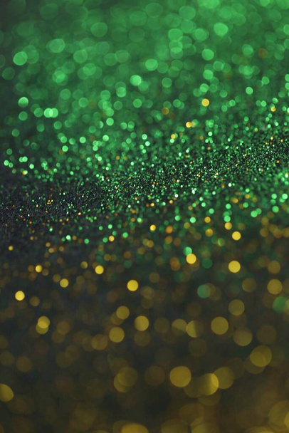 bokeh background. glitter on a black background.Festive New Year and Christmas shiny glitter layout. - Fotografie, Obrázek