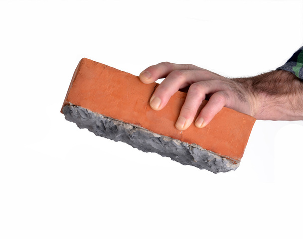 Constructor worker holding a cement construction brick. - Foto, Bild