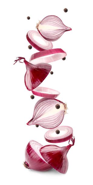 Cut flying onion on white background - Zdjęcie, obraz
