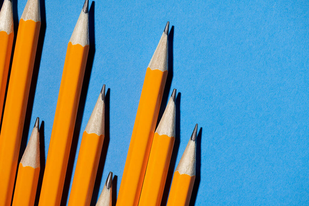 graphite pencils on a blue background macro photo, school and office supplies - Photo, Image