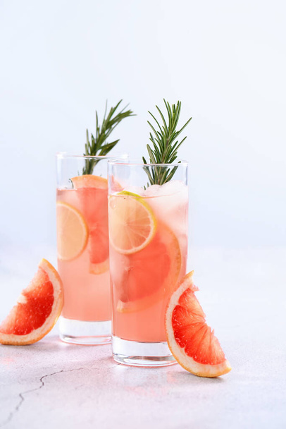 Fresh lime and rosemary in combination with fresh grapefruit juice and tequila. This cocktail is full of vibrant citrus flavors and aromatic herbs, showcasing the best of winter seasonal fruits. - Photo, Image