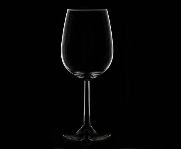 wine glass isolated on a black background. - Фото, изображение