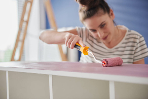 Focus woman painting old furnitures by herself - Photo, Image