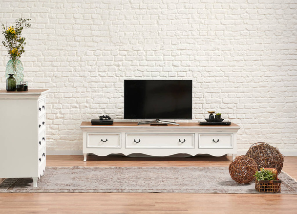 Decorative white classic television unit and brick wall background. - Fotoğraf, Görsel