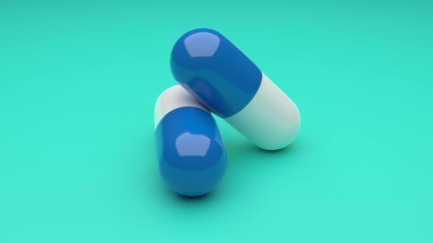Zwei weiß-blaue Pillen rotieren auf grünem Hintergrund. Nahtloses Looping. 4K UHD. 3D-Darstellung.  - Filmmaterial, Video