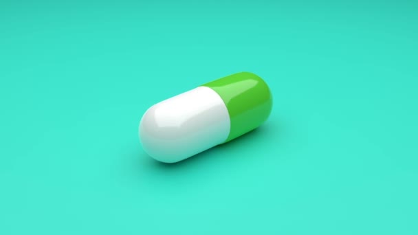 Wit-Groene pillen geïsoleerd draaiend op groene achtergrond. Naadloos lussen. 4K UHD. 3d destructie. - Video