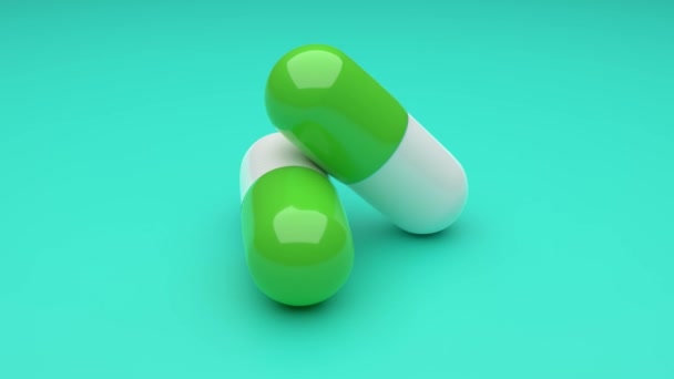 Zwei weiß-grüne Pillen rotieren auf grünem Hintergrund. Nahtloses Looping. 4K UHD. 3D-Darstellung. - Filmmaterial, Video