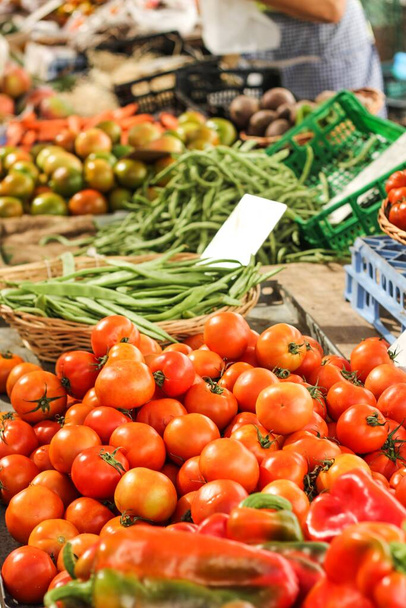 A vertical selective focus shot of fresh organic vegetables in the market - Fotografie, Obrázek