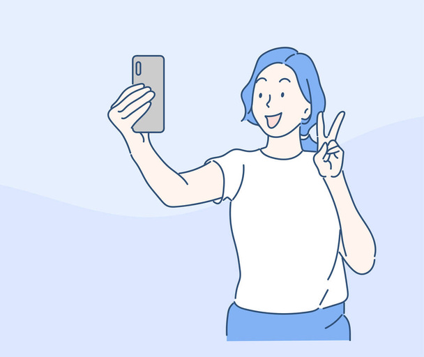 Młoda kobieta robi sobie selfie na stojąco. Koncepcja przyjaźni i młodzieży. Ręcznie rysowane w stylu cienkiej linii, ilustracje wektorowe. - Wektor, obraz