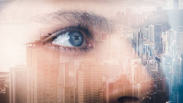 the double exposure image of the pretty woman's eyes overlay with cityscape image.  - Photo, Image