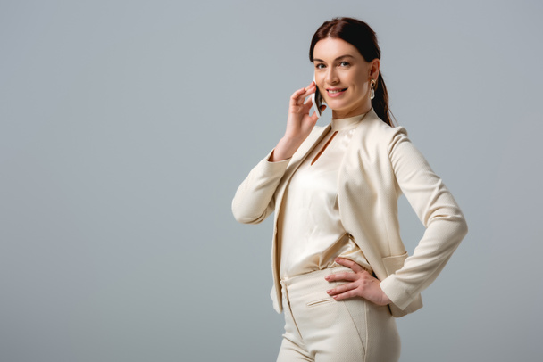 Smiling businesswoman talking on smartphone isolated on grey, concept of body positive  - Foto, Imagem