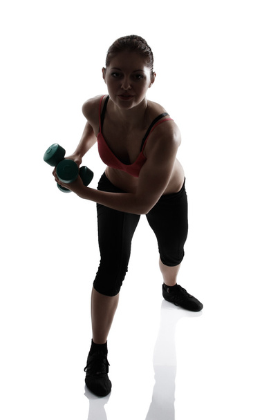 Athletic woman doing lunge - Foto, imagen