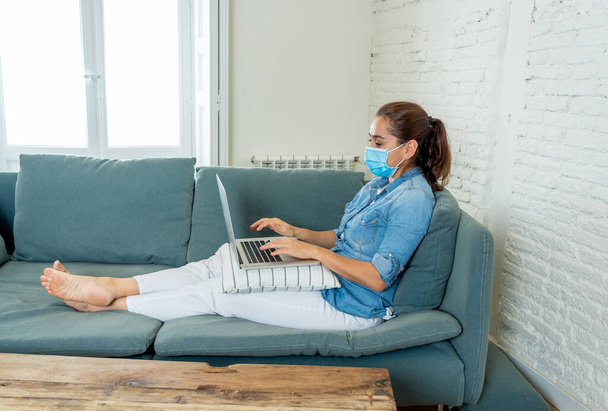 Happy successful woman on laptop working from home. Freelancer or employee in video conference virtual meeting working remotely in COVID-19 lockdown, social distancing and New normal concept. - Fotoğraf, Görsel