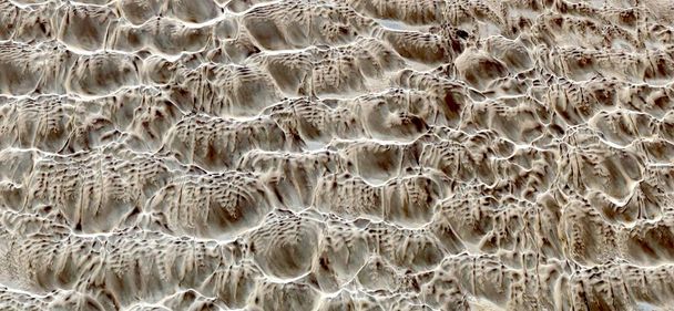 fossil stream, abstract photography of the deserts of Africa from the air, aerial view of desert landscapes, Genre: Abstract Naturalism, from the abstract to the figurative, contemporary photo  - Photo, Image