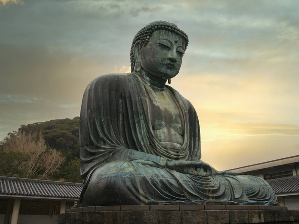 The "Great Buddha" (Daibutsu) bronze statue at the Kotoku-in Buddhist temple in the city of Kamakura in Kanagawa Prefecture, Japan - the statue has been designated "National Treasure" status. - Photo, Image