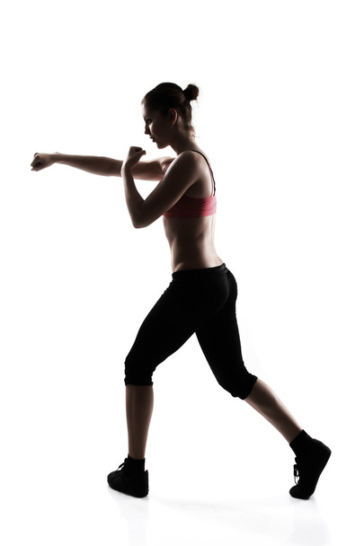 Woman doing martial arts exercise - Fotó, kép
