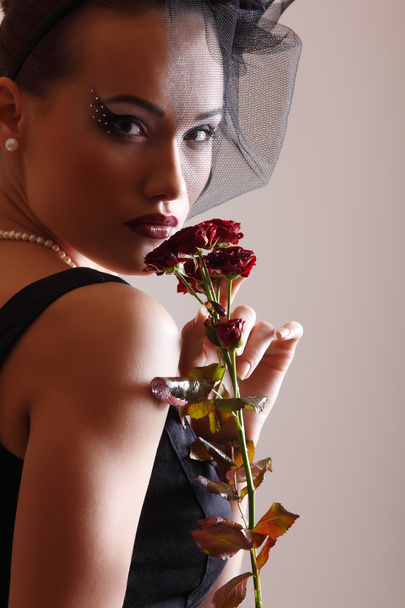 Beautiful woman with roses - Zdjęcie, obraz